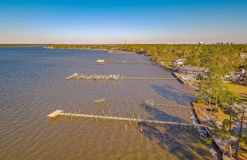 Orange Beach Condo | Bay View Condo with WiFi, Balcony, AC, W/D, Seasonal Outdoor Pool, & Boat Dock