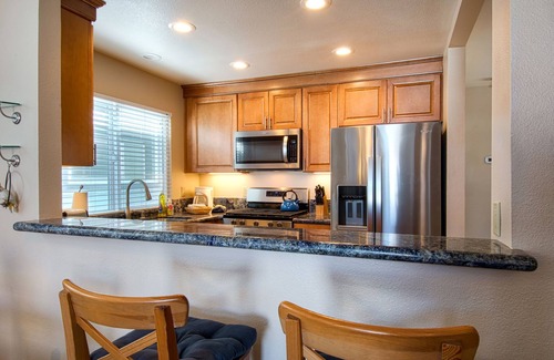 West Newport Condo | Enjoy Ocean Views from the Large Roof-Top Deck Adjacent to the Newport Pier!