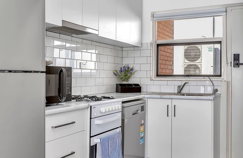 West Beach Apartment | 2 Bedroom Seaside Suite just Steps from the Shore + Arcade & Balcony