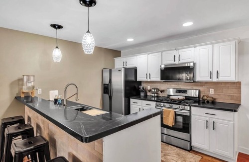 Blasdell House | Clean,Cozy &Updated Home with Jacuzzi, Fenced in yard, BarShed, Firepit & MORE!