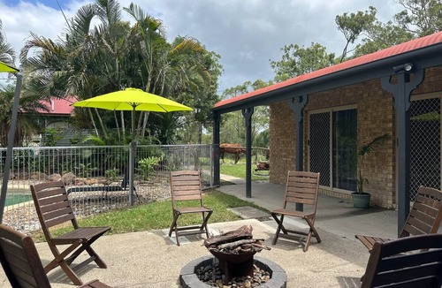 Jimboomba House | Kingfisher Lodge: country retreat with king beds, fireplace & pool on acreage