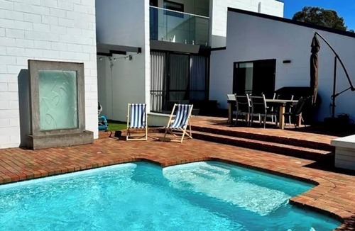 Golden Square House | Palm Springs Resort Style Living - 3 Bathrooms + Pool & Indoor Wood Fire Place!