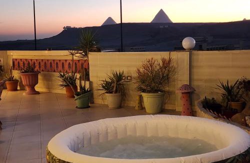 Pyramids Gardens Apartment | private rooftop with hot jacuzzi and pyramids view