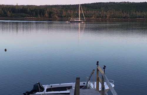 Liscomb Cottage | Private self contained cottage with terraced decking right to the water.