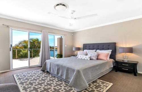 Banksia Beach House | Spacious Canal Home with Pool