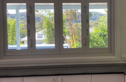 Forresters Beach House | Spacious holiday house ducted air conditioning walk to beach. In ground pool.