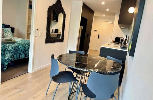 Reid Apartment | Stay in the heart of Canberra in style. Enjoy resort-style pools, rooftop gardens, and a private terrace. Perfectly positioned opposite Canberra Center, this modern retreat features secure parking, high-speed WiFi, and a fully equipped kitchen!