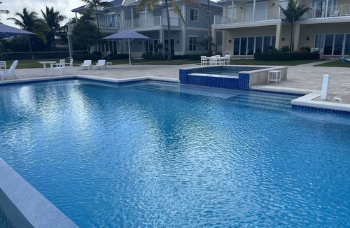 Jimmy Hill Villa | Stunning 4 bedroom Beachfront Villa! Infinity pool & hot tub.