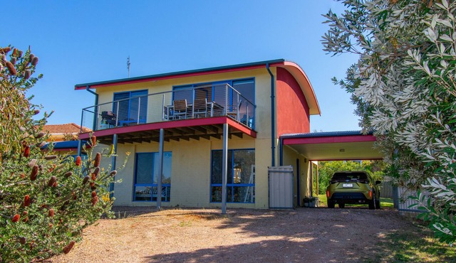 A two-storey house with sweeping views of Bass Strait and the North Arm.