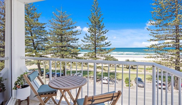 Discover coastal relaxation with this beachfront apartment.