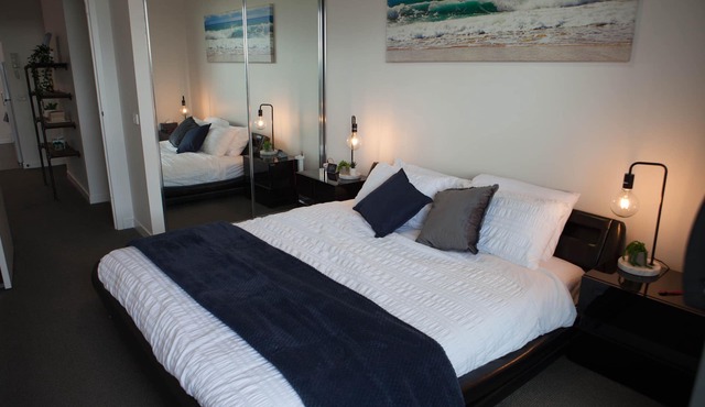 Modern spacious 1BDR, wifi, EV charging & parking, close to shops