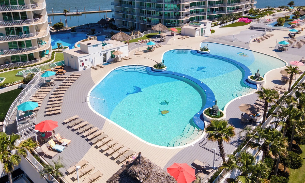 Orange Beach East Condo | Luxurious Bayside Four Bedroom Condo with Panoramic Views. Complimentary Boat Slip!